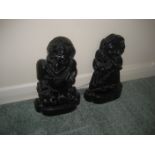 A pair of cast iron Punch and Judy door stops.