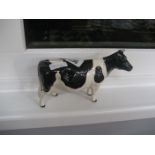 A Beswick dairy cow.