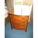 A reproduction 20th century burr walnut Serpentine chest of drawers.