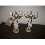 A pair of late 19th century figural candlesticks