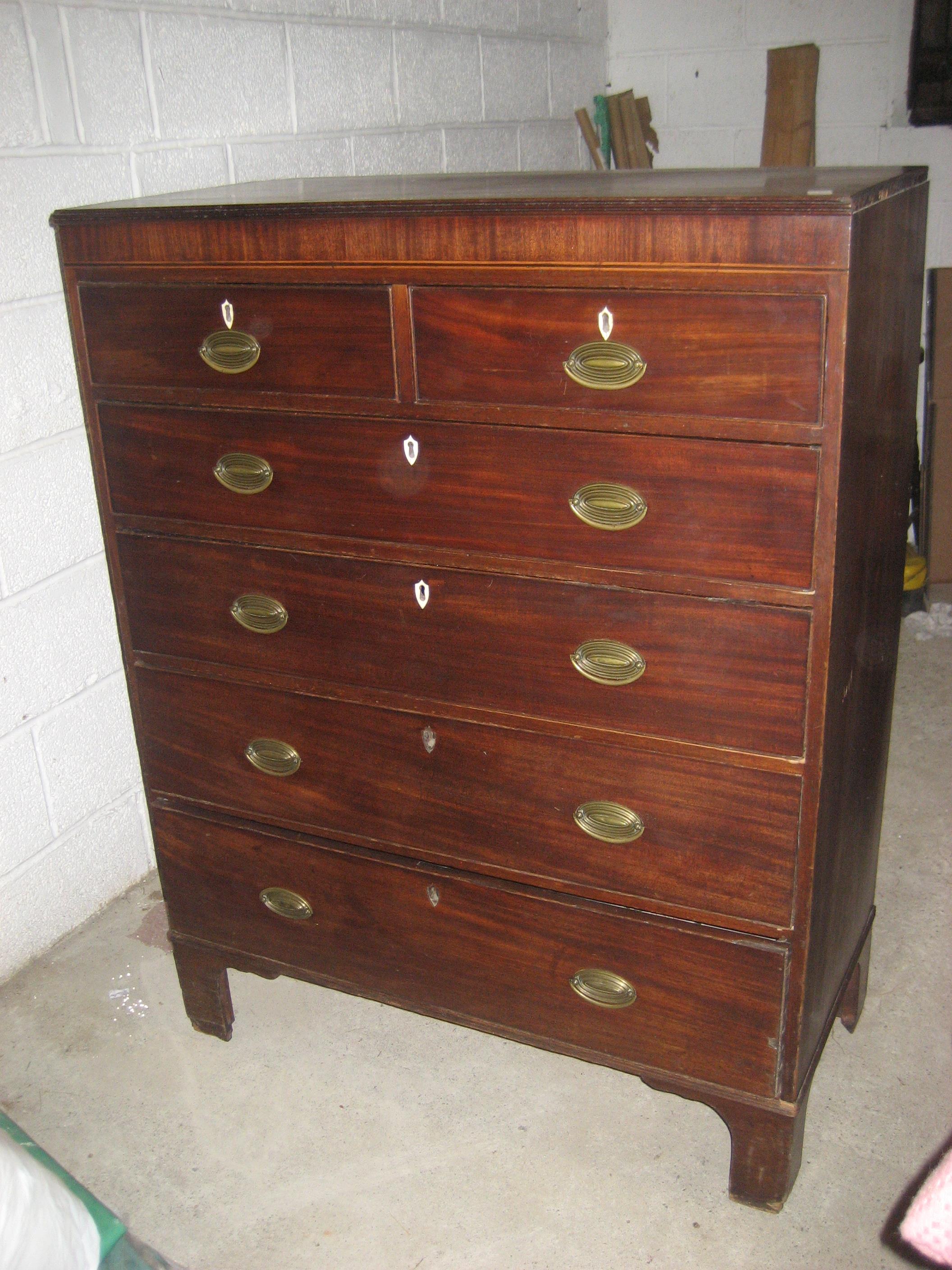 A George III oak chest of drawers.