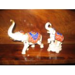 A pair of German type china hand painted elephants.
