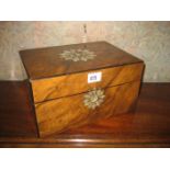 A Victorian walnut work box with mother of pearl detail to top.