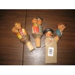 Novelty Black Forest type carved wooded bottle stoppers (4)