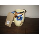 A hand painted floral jug
