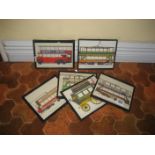 Various framed transport prints.