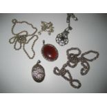 A silver amber type pendant, a curb silver chain, a further silver chain and items of white metal (