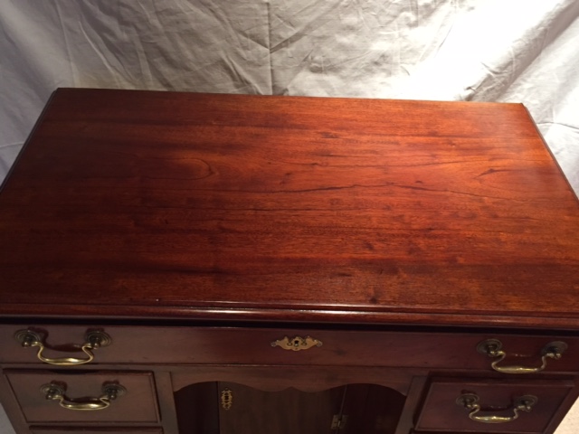 A George III magogany desk raised on ogee bracket feet, 78cm wide by 45cm deep. - Image 2 of 5