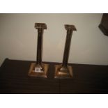 A pair of 19th century square base copper candlesticks