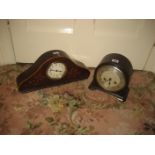 A Smith bakelite mantel clock together with another early 20th century example (2).