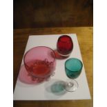 A 19th pedal foot cranberry bowl, a modern glass vase and an early 20th cordial glass (3).