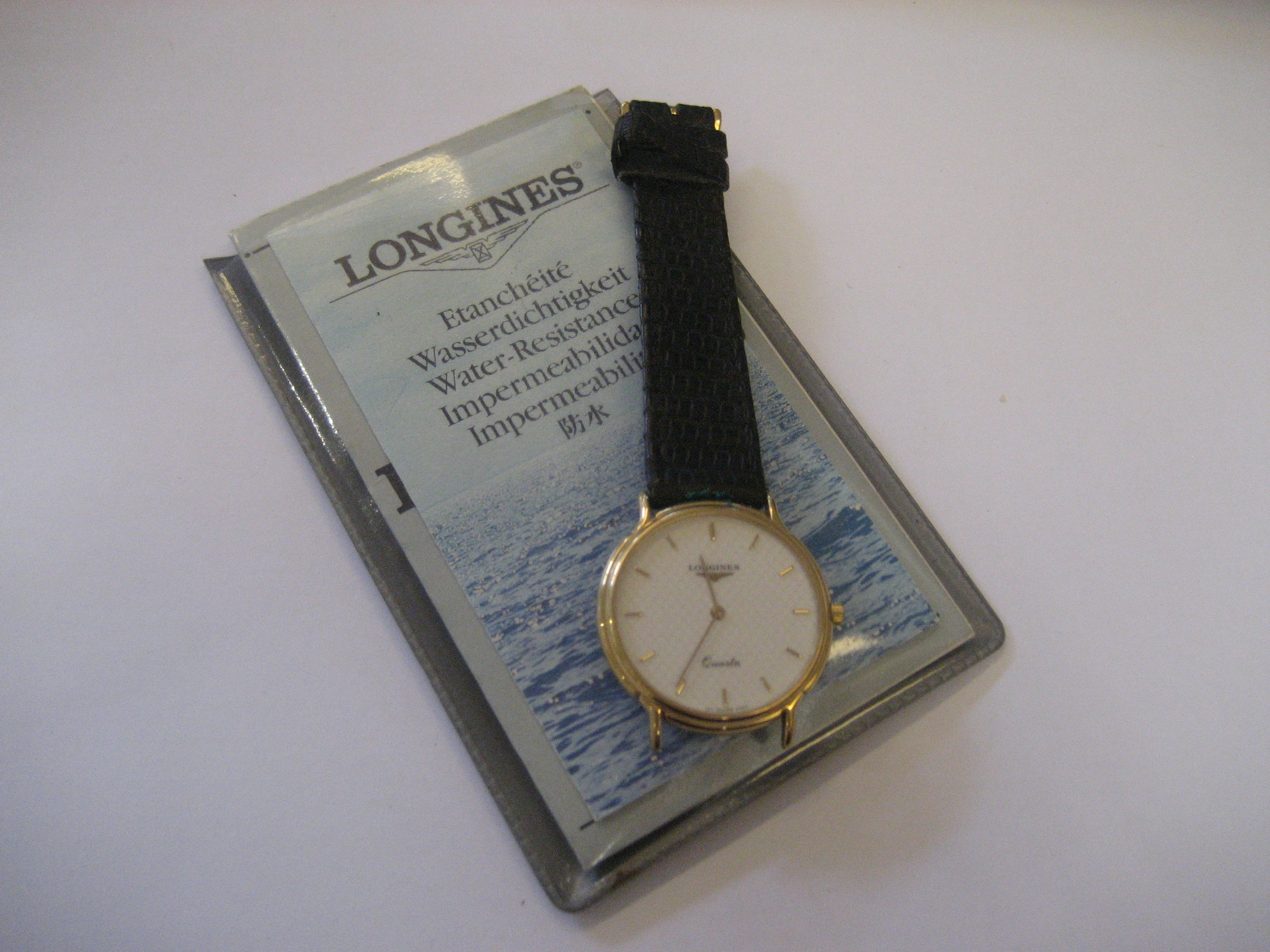 A Longines watch with original paperwork (a/f).