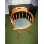 An early oak swivel desk chair.