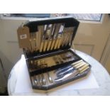 A box of plated cutlery.