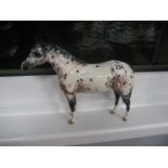 A Beswick horse.