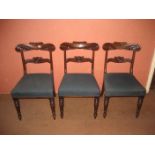 Three 19th century mahogany bar back dining chairs.