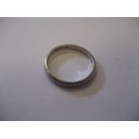 A platinum wedding band marked platinum, 2.8g.