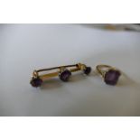 An amethyst 3 stone bar brooch together with a 9ct gold ring similar (2).