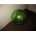 A large green witch ball