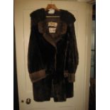 A 20th century ladies fur coat with another (2).
