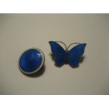 Two enamel silver backed brooches.
