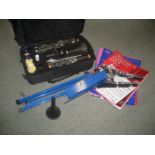 A CASED CLARINET WITH MUSIC STAND ETC.
