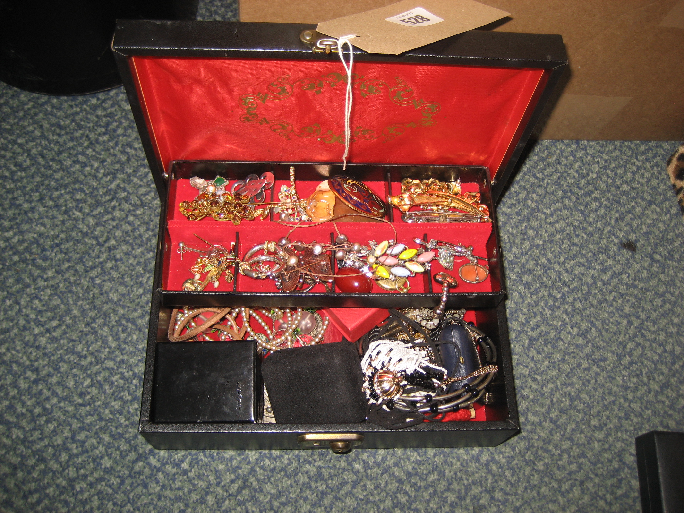 A BOX OF COSTUME JEWELRY.