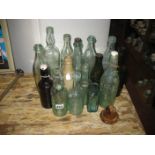 A COLLECTION OF NAMED GLASS BOTTLES ETC