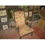A LATE 19TH CENTURY UPHOLSTERED ARMCHAIR