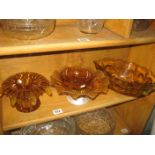 A COLLECTION OF AMBER COLOURED GLASSWARE (CONTENTS OF SHELF)