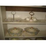 2 CAKE STANDS & 2 LIDDED TUREENS (CONTENTS OF 2 SHELVES)