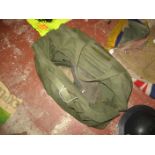 AN ARMY TYPE BAG CONTAINING EMPTY RIFLE ROUNDS ETC