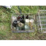 COLLECTION OF GLASS BOTTLES IN METAL BOTTLE TRAY