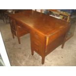 AN EARLY 20TH OAK DESK WITH SIDE EXTENSIONS