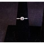 18K WHITE GOLD + DIAMOND SOLITAIRE RING WITH CERT. DIAMOND .