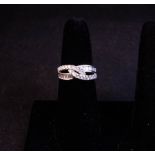 18CT WHITE GOLD + DIAMOND CROSS OVER RING