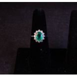 18CT WHITE GOLD COLUMBIAN EMERALD AND DIAMOND CLUSTER RING. TOTAL EMERALD 2CT, TOTAL DIAMOND .