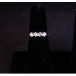 18CT WHITE GOLD 4 STONE DIAMOND RING. TOTAL DIAMOND .