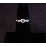 WHITE GOLD AND DIAMOND RING . CENTRE STONE .25CT WITH DIAMOND SHOULDERS.