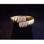 CARTIER 18K GOLD + DIAMOND CROSSOVER BANGLE