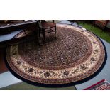 NAVY GROUND CIRCULAR PERSIAN RUG WITH ALL OVER PATTERN AND CREAM BORDER.