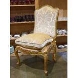 Louis XV style hall chair, having a carved crest above the high back, with a loose down cushion, and