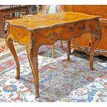 Louis XV style bureau plat, having a shaped marquetry inlaid top, above a single drawer, and