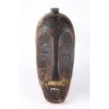 African wooden mask, executed in the Lega style, 18"h x 8"w