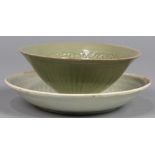 (lot of 2) Group of Chinese ceramics: the first, a celadon bowl with floral scrolls to the interior;