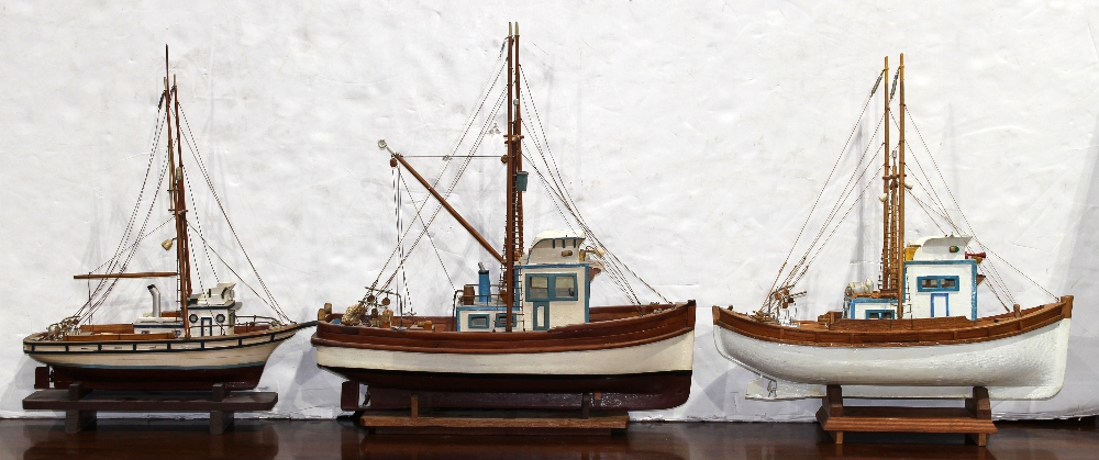 (lot of 3) Model boat group, consisting of three fishing boats, each hand-painted, with rigging