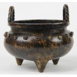 Chinese bronze censer, with rope patterned inverted U form handles on the rim of the vessel, the