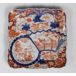 Japanese square Imari charger, Meiji period, floral motifs in colors with foliate rim, approx. 12.