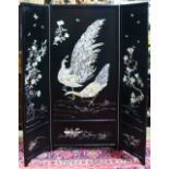 Korean mother-of-pearl lacquered three panel screen, fronted by a pair of peacocks and flowers, 62.