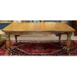 Victorian dining table circa 1870, having a square top with three 18" leaves, and rising on turned